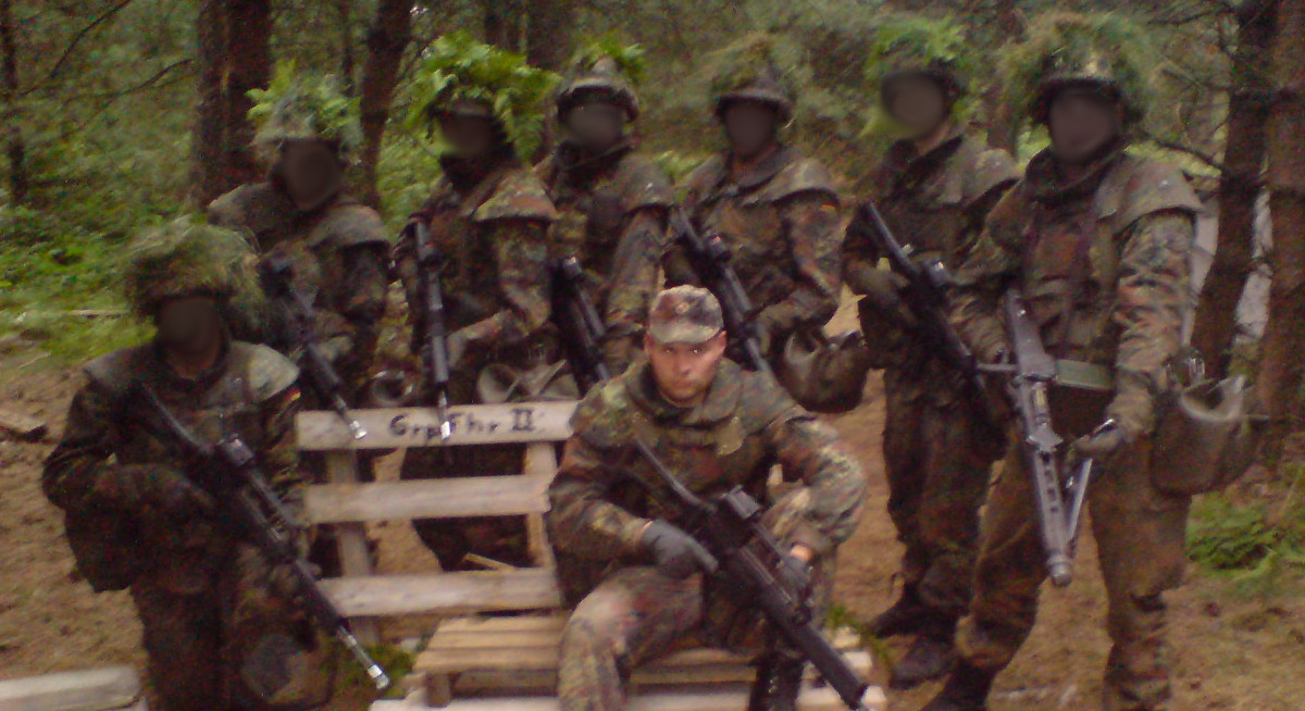 Dan leading a group of camouflaged soldiers.